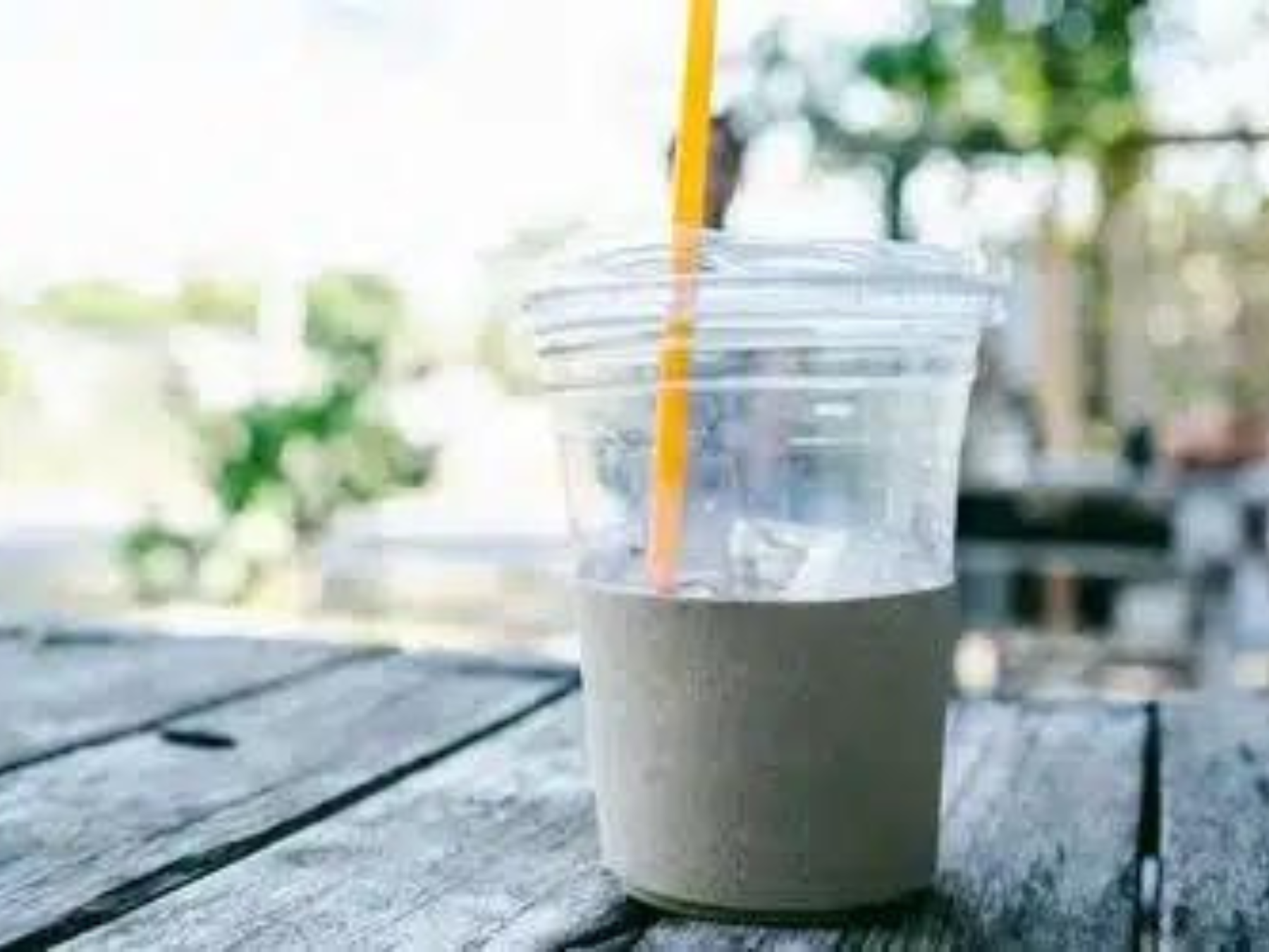 An image showing a plastic cup and a straw.